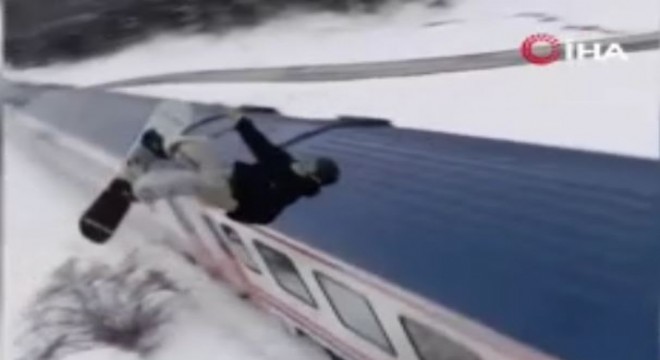 Snowboardla Doğu Ekspresi'nin üzerinden atladı